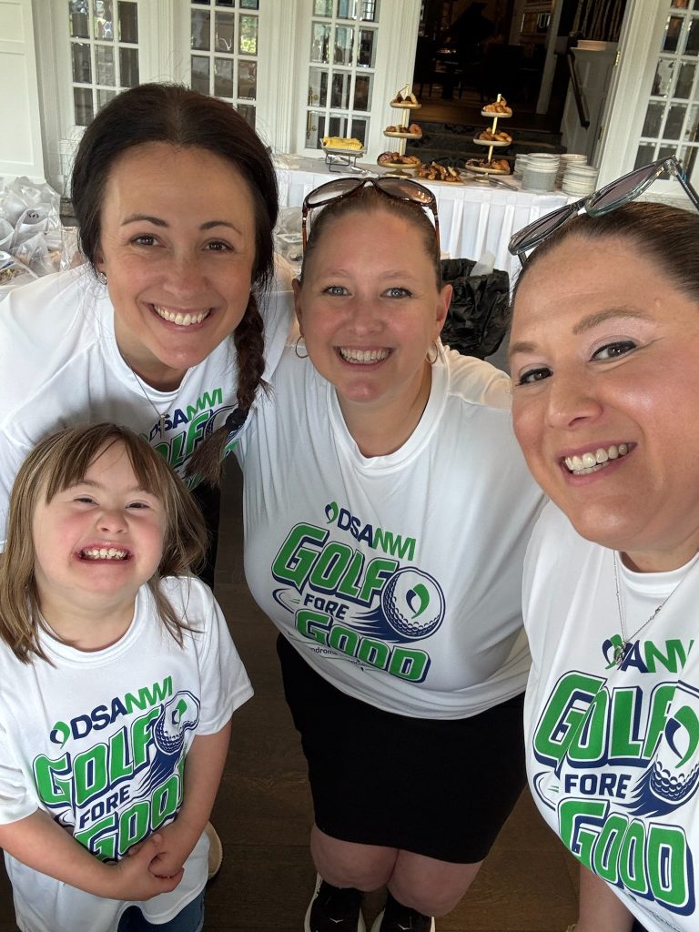 DSANWI volunteers and a young girl at the Golf Fore Good outing