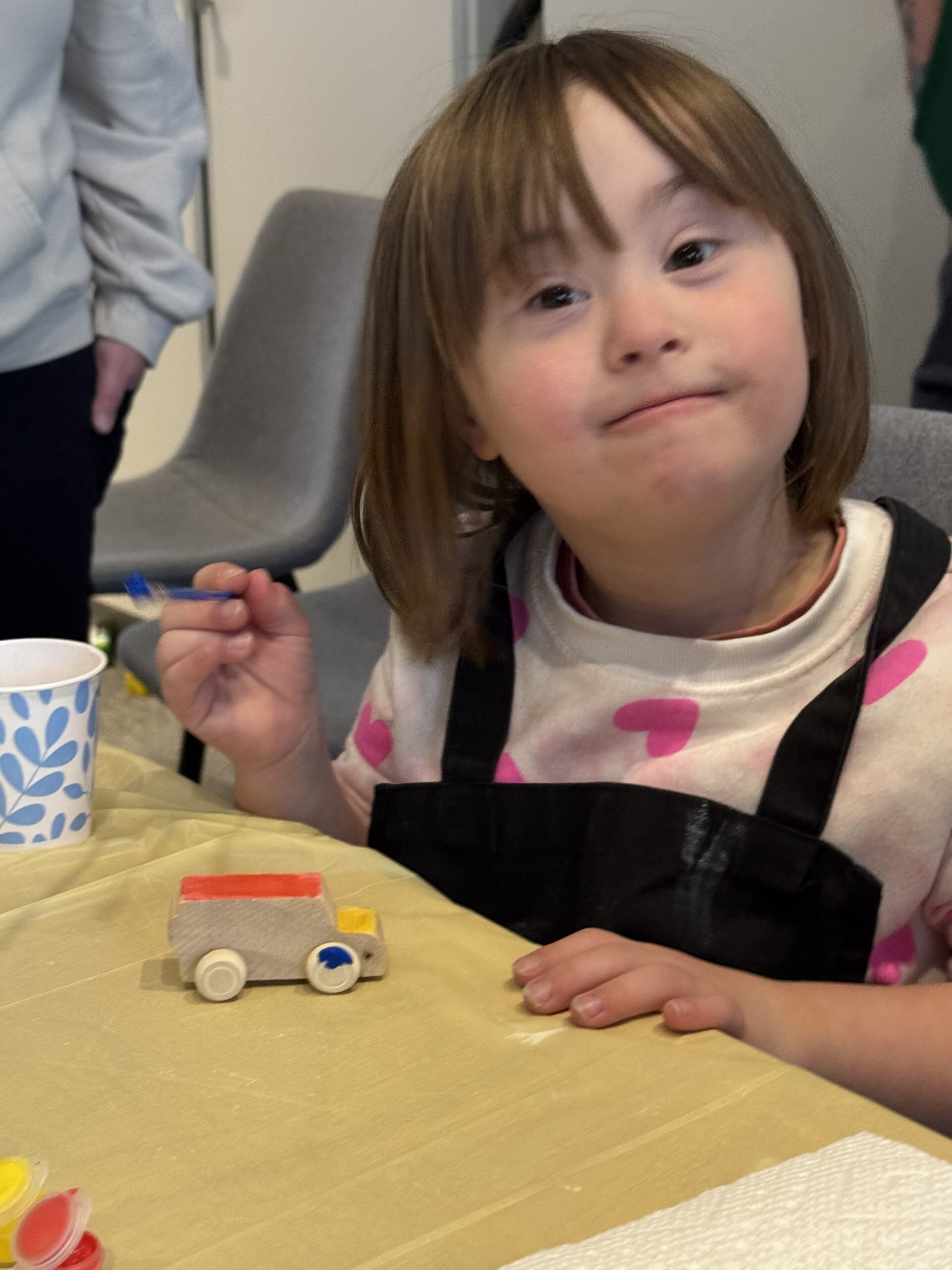 A young girl at a DSANWI activity table